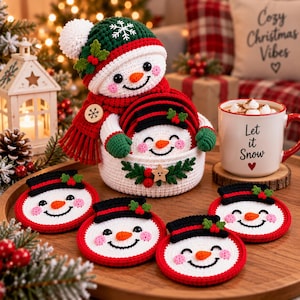 May include: A set of crocheted snowman coasters with a matching snowman-shaped basket. Each coaster features a white face, black top hat, orange nose, and pink cheeks. The basket includes a decorative wooden button and holly accents.