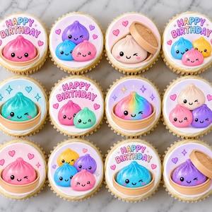 May include: A set of twelve cupcakes featuring edible toppers with colorful illustrations of smiling, winking dumplings in bamboo steamers. Some toppers include the text "HAPPY BIRTHDAY" in a playful font, surrounded by small pink and blue hearts.