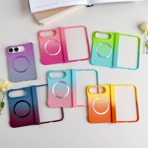 May include: A collection of six foldable phone cases featuring gradient color schemes including purple, pink, green, blue, and yellow. Each case includes a circular magnetic ring on the back and a rectangular cutout for the camera lens.