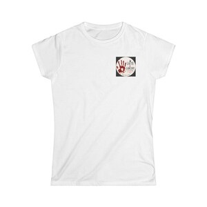 May include: A plain white short-sleeve t-shirt featuring a small square graphic on the upper left chest. The graphic displays a red handprint with the text Latte & Larceny, a coffee cup icon, and additional small printed text within a circular border.