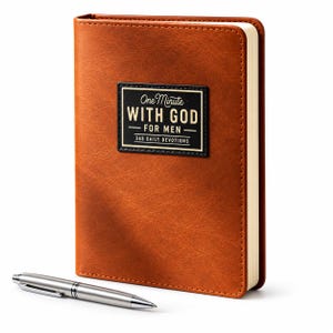 May include: A brown leather-textured devotional book with a black rectangular label on the front cover featuring the white and gold text One Minute WITH GOD FOR MEN 365 DAILY DEVOTIONS, accompanied by a silver metal ballpoint pen placed in front.