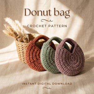 May include: Three circular crochet bags in rust, sage green, and mauve, each featuring a central opening. The text Donut bag CROCHET PATTERN and INSTANT DIGITAL DOWNLOAD is visible. A woven basket containing dried pampas grass sits behind the bags.