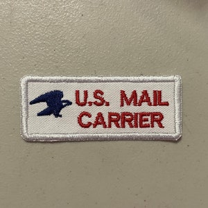May include: White embroidered patch with a blue eagle and the text "U.S. MAIL CARRIER" in red.