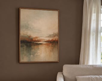 May include: A rectangular framed wall art piece featuring an abstract landscape painting with muted tones of beige, soft blue, and burnt orange. The artwork depicts a hazy horizon line over a body of water with blended, textured brushstrokes.