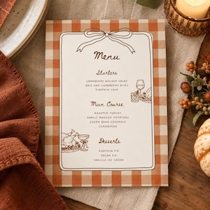 May include: A rectangular menu card with an orange and white gingham border and a hand-drawn bow at the top. The text lists Starters, Main Course, and Desserts with illustrations of wine glasses and food items in brown ink on a white background.