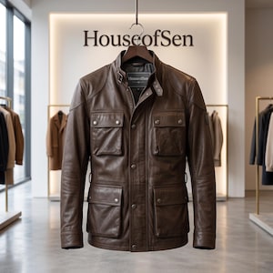 May include: A brown leather jacket featuring a high collar with a buckle strap, a front zipper closure with a snap-button placket, and four large patch pockets with snap-button flaps. The interior label displays the text HouseofSen.
