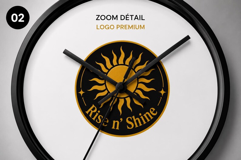 Puede incluir: Un reloj de pared redondo con marco negro y esfera blanca. El centro presenta un emblema circular negro con un gr&aacute;fico de sol dorado y el texto "Rise n' Shine" en letras doradas. Tres manecillas negras est&aacute;n situadas sobre el emblema central.