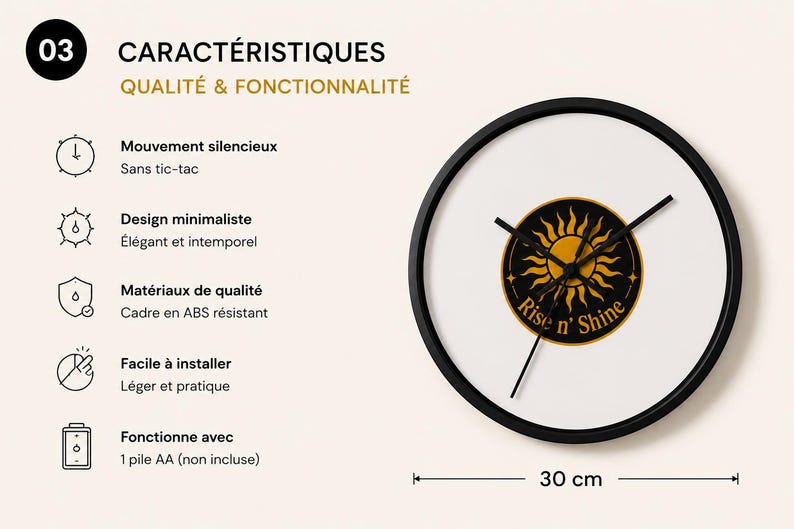 Puede incluir: Un reloj de pared redondo con marco negro y esfera blanca que presenta un emblema circular negro central con un gr&aacute;fico de sol amarillo y el texto Rise n' Shine. El reloj tiene manecillas negras, un di&aacute;metro de 30 cm y texto con funciones.