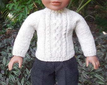 Hand knitted, beige, Irish sweater and black, corduroy pants made for American Girl and similar 18 inch dolls.