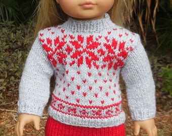 This is a gray and red, hand knitted, Norwegian style ski or snow suit made to fit American Girl and other similar dolls.