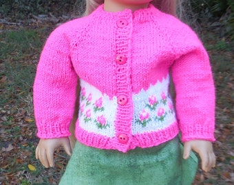 Hand knitted, pink sweater with a beret and a green A-line skirt made to fit American Girl and similar 18 inch dolls.