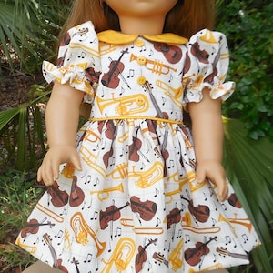 Dress with musical instruments made for American Girl and similar 18 inch dolls.