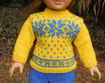 Yellow and blue Norwegian knitted outfit consisting of a sweater, hat, and pants made to fit American Girl and other similar 18 inch dolls.