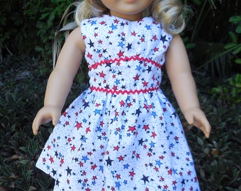 4th of July dress . It is white with red and blue stars made for American Girl and similar 18 inch dolls.