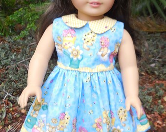 Blue and yellow summer dress with a yellow sun hat made to fit American Girl and similar dolls.