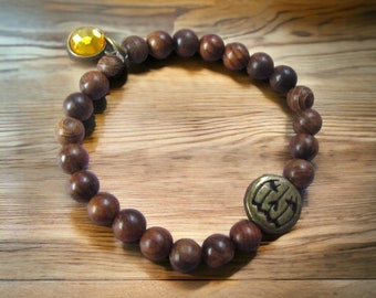 Brass Jack-o'-Lantern Stretch Bracelet with Brown Wood Beads
