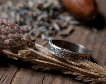 Rustic wedding ring, sterling silver or gold wide band textured against stone and oxidised, 5mm wide, gender neutral for him, her or they.