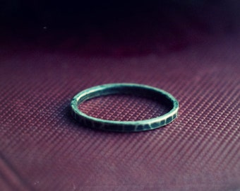 Sterling silver hammered stacking ring, a simple skinny 925 silver band, hammered and oxidised for a rustic, industrial look.