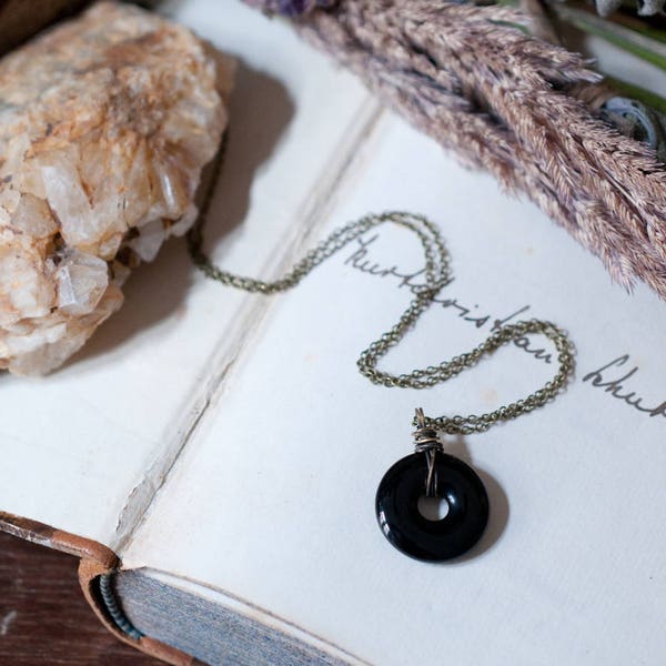 Onyx pendant necklace, black gemstone donut, oxidised sterling silver or brass, wire wrapped, natural amulet, inner strength and protection.