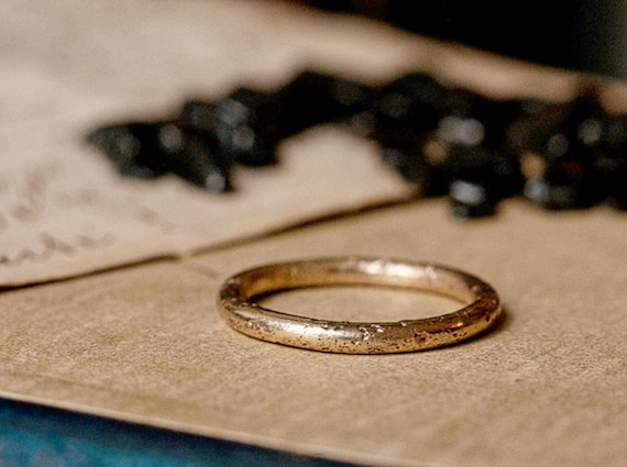 Skinny rustic gold wedding ring, an alternative wedding ring with organic texture.
