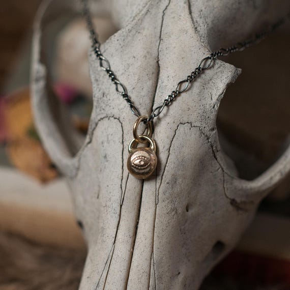 Solid gold evil eye charm necklace, an ancient protection amulet in 8k gold with an oxidised sterling silver figaro chain. a witchy gift