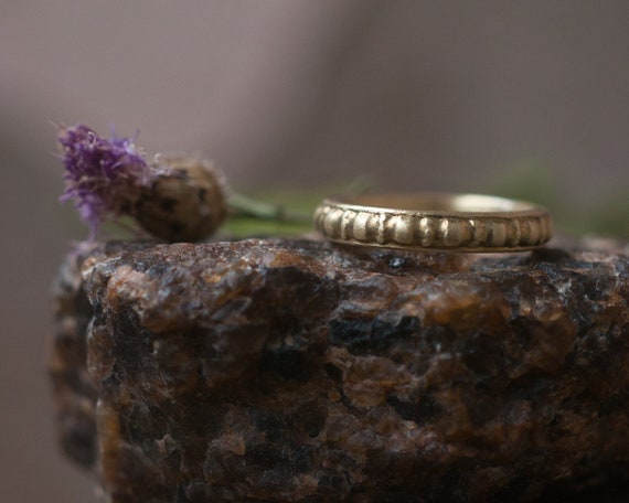 Rustic gold pattern ring, an alternative and gender neutral wedding band.