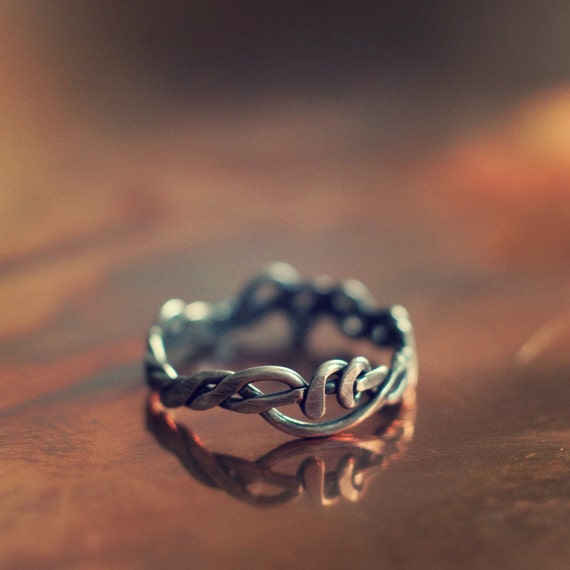 Entwined ring, a twisted wire ring in sterling silver, unisex and stackable on finger, thumb or pinkie