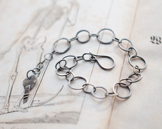 Sterling silver forged link bracelet with key charm, lucky talisman for new beginnings and unlocking opportunity.