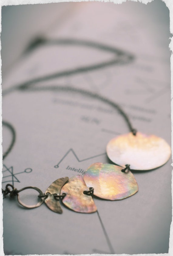 Moon phase necklace in hammered brass, fire oxidised and polished for lunar worshippers and witchy folk of all genders.