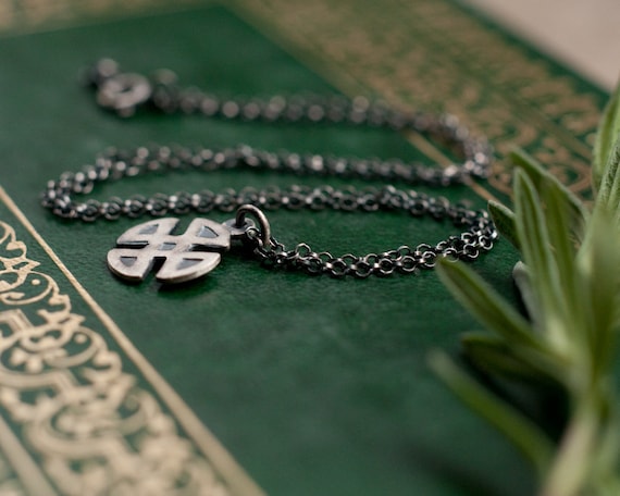 Shield knot necklace, a Celtic knot and Four Corners talisman for protection and warding in sterling silver.