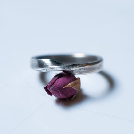 Mobius geometric wedding ring in sterling silver, a symbol of unity and eternal love