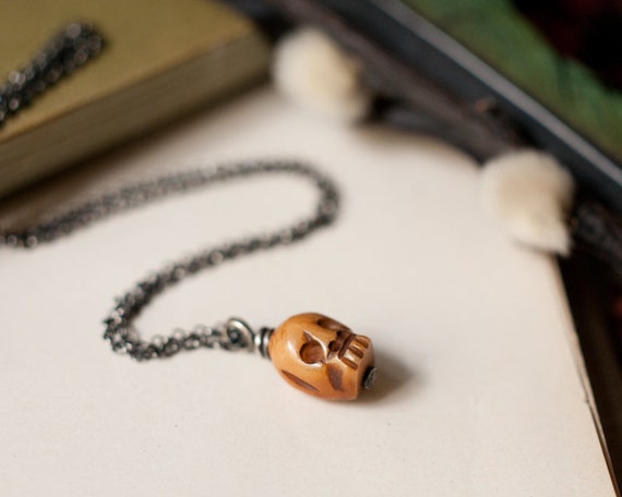 Little bone skull pendant necklace in sterling silver with an 18" richly oxidised chain. Gender neutral dark fashion.