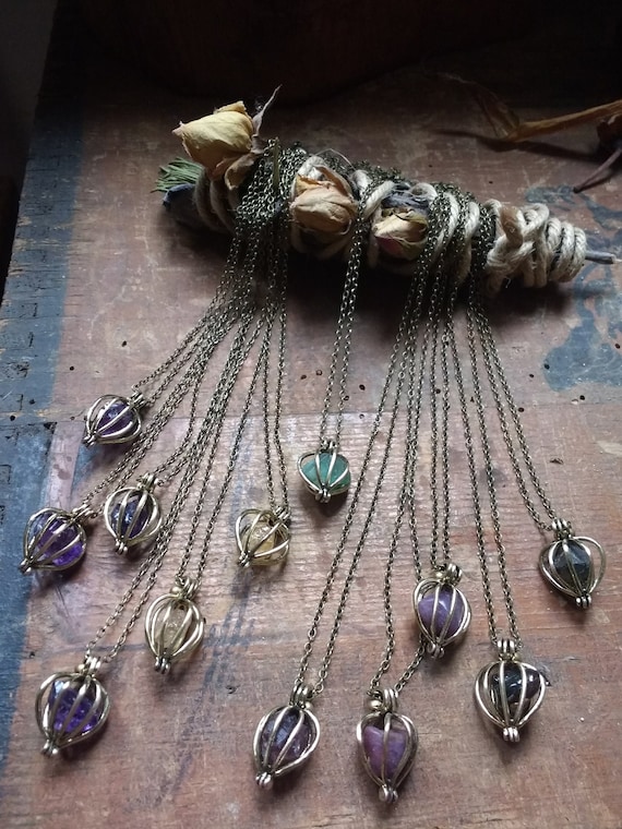 Brass gemstone cage necklaces, amethyst, topaz, emerald, ruby, magnetite, Mexican fire agate, tourmaline, crystal cage amulets talisman