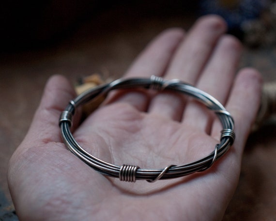 Wound and bound bangle, slim gyre bangle, wire wrapped sterling silver, ouroboros bangle, infinity unisex bangle, oxidised sterling silver.