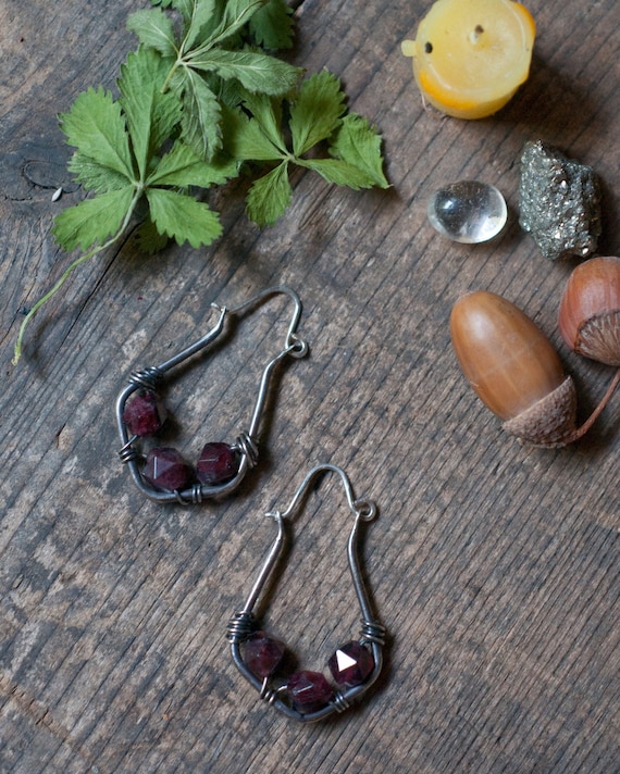 Sterling silver and garnet wire wrapped hoop earrings with faceted garnets, a warrior stone for fierce witchy folk