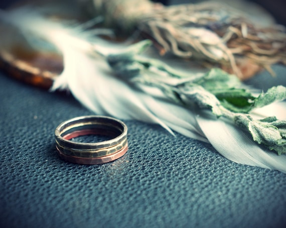 Mixed metal stacking ring set, with hammered copper, brass, and sterling silver bands.