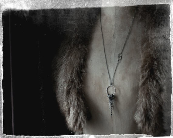 A sterling silver skeleton key charm hand forged and oxidised in a long layering talisman necklace. A road opener gift for witchy folk.