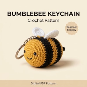 May include: A crochet bumblebee keychain with yellow and black stripes, white wings, and a metal keyring. The text reads BUMBLEBEE KEYCHAIN Crochet Pattern, Beginner Friendly, and Digital PDF Pattern. The bee has small black eyes and a stitched smile.
