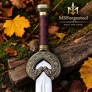 May include: A sword with a polished steel blade, a dark brown leather-wrapped grip, and an ornate brass crossguard featuring intricate scrollwork. The pommel is also brass with matching decorative patterns. The text MSForgesteel RULE THE EDGE is visible.
