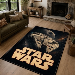 May include: A rectangular area rug featuring a dark space background with the Millennium Falcon spaceship and the Death Star. The iconic Star Wars logo is printed in large, bold, light-coloured letters at the bottom of the rug design.