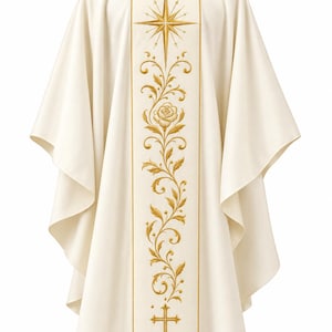 May include: An off-white liturgical chasuble featuring a central vertical panel with gold embroidery. The design includes a star at the top, a rose surrounded by scrolling vines in the middle, and a cross at the bottom. Eliana Rose Liturgical logo.