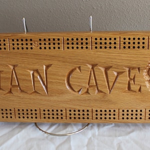 Man Cave cribbage board with 3d carved beer mugs made from solid Oak