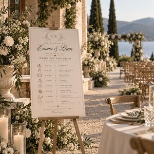 Puede incluir: Un letrero rectangular blanco de programa de boda sobre un caballete de madera con texto negro que dice The Wedding of Emma & Liam, September 15, 2023, Wedding Program, y un horario de eventos con iconos para la ceremonia, recepción y baile.