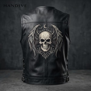 May include: A black leather vest featuring the text HANDIVE at the top. The back displays a large, detailed graphic of a skull with expansive feathered wings, a crescent moon, and small bats, all rendered in shades of grey and off-white.