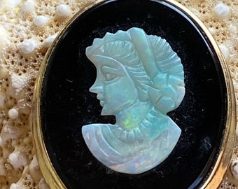 Gorgeous vintage cameo featuring a carved opal inlay with black onyx in 14 karat gold