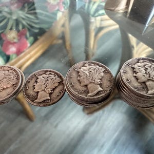 May include: A set of three ceramic mugs with a speckled, matte finish. The mugs are in shades of cream, light brown, and dark brown. Each mug has a simple, minimalist design, perfect for coffee or tea.