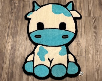 Blue cow tufted rug