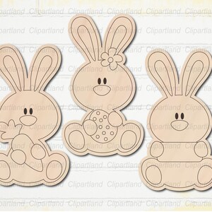 May include: Three wooden Easter bunny cutouts. The bunnies have large ears, round bodies, and smiling faces. One bunny holds a carrot, another holds an Easter egg, and the third has a blank space for customization. The cutouts are light brown.