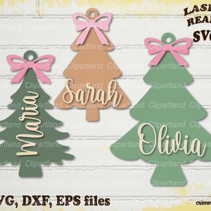 May include: Three Christmas tree ornaments in green and tan with pink bows. Each tree has a name: Maria, Sarah, and Olivia. The image also includes the text "LASER READY SVG" and "SVG, DXF, EPS files."