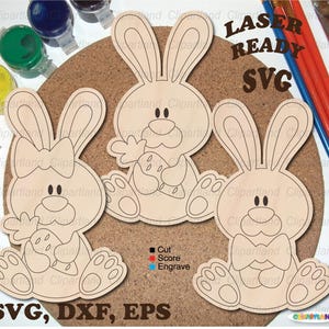 May include: Three wooden bunny cutouts with engraved details, perfect for crafting. One bunny has a bow, another holds an egg, and the third has a bow tie. The image includes the text "LASER READY SVG" and "SVG, DXF, EPS".